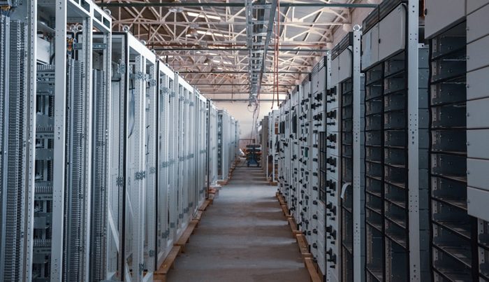 Rows of equipment racks in a data centre hall